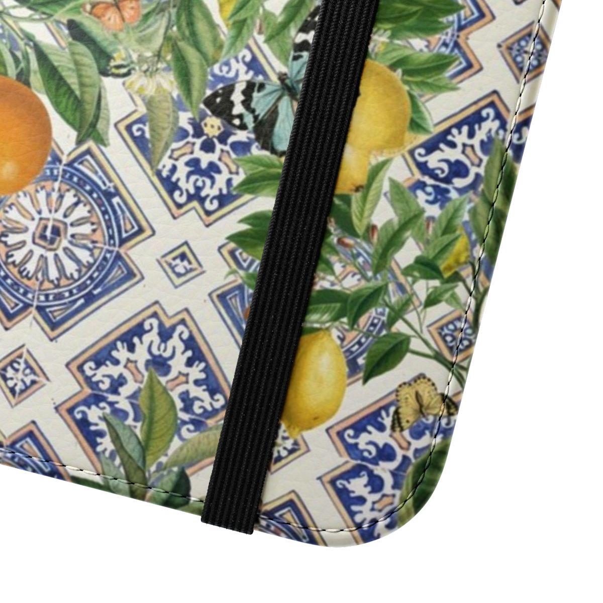 Flip cover phone case featuring a vibrant Sicilian-inspired pattern of citrus fruits and Mediterranean tiles in shades of blue, yellow, and orange. - Close Up