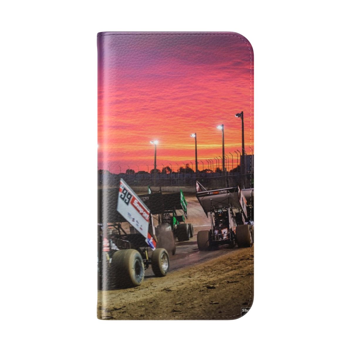 Flip cover phone case featuring a vibrant sunset over a speedway track with race cars. - Folded Back