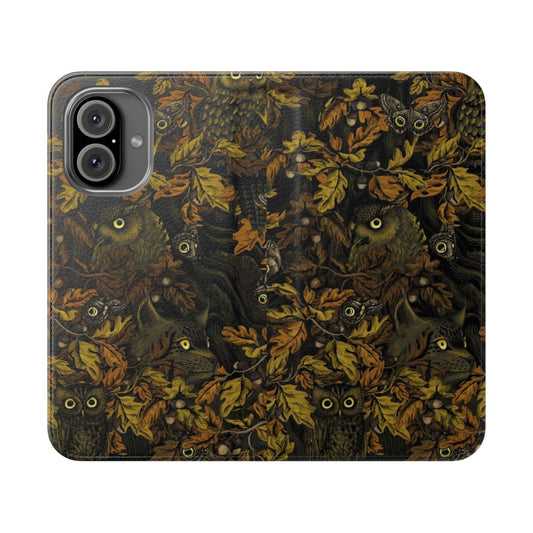 Closeup of a stylish flip phone case featuring a camouflage pattern with autumn leaves, oak, and owls.