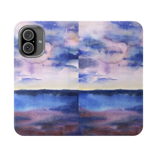 Watercolor landscape design with sky and clouds on a phone case.