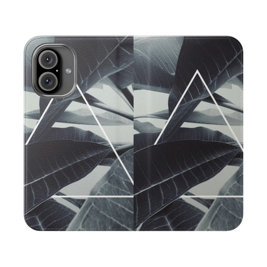 Closeup of a modern, geometric plant-themed flip phone case with black, white, and green colors.