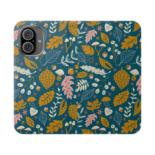 Closeup of a flip cover phone case with a fall foliage design in gold and blue colors.