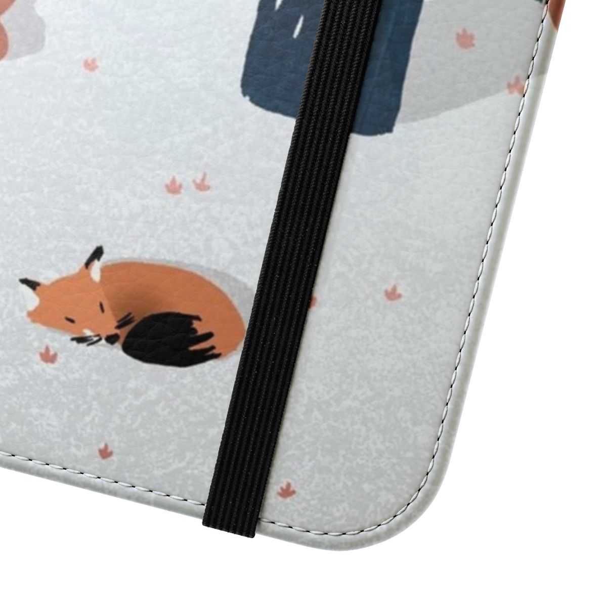 A phone case featuring a cozy winter forest scene with a fox, trees, and snow. - Close Up