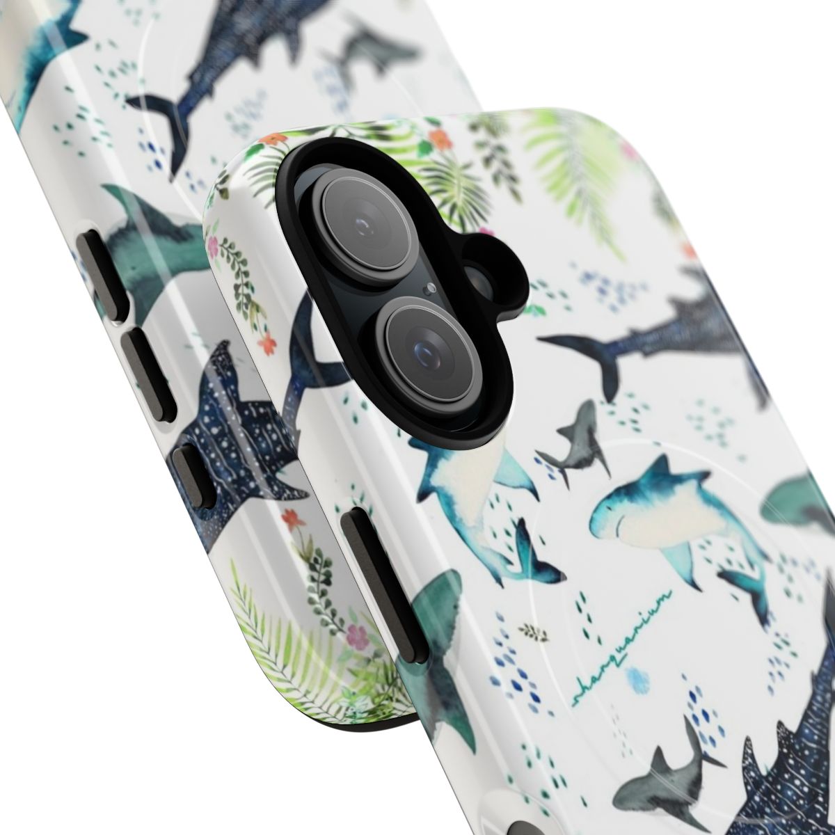 Closeup of a phone case featuring a colorful floral and shark design in an underwater scene. - Detail