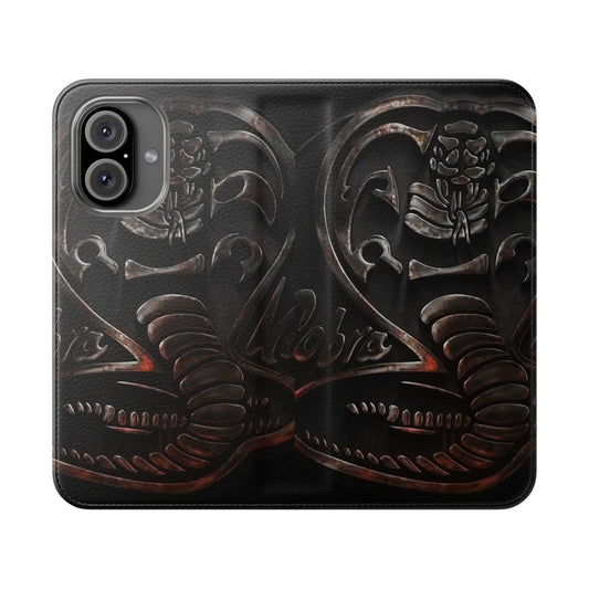 Silver metal flip cover phone case with a snake design, inspired by the Cobra Kai TV series