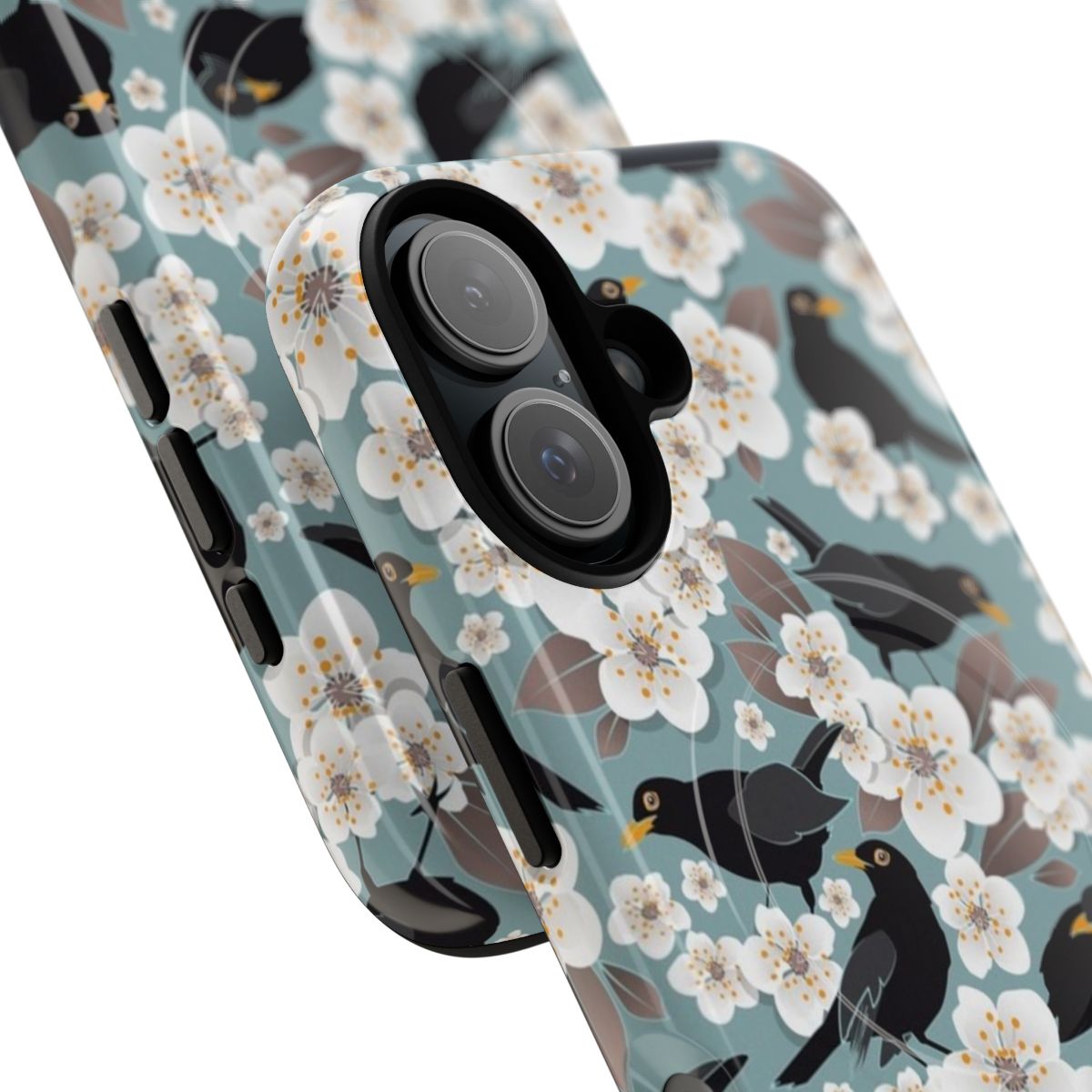 A phone case featuring a colorful illustration of a blooming cherry tree with birds flying around it. - Detail