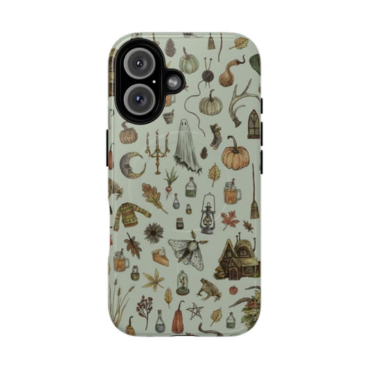 Cozy green phone case with witchy elements like black cats, moons, and brooms