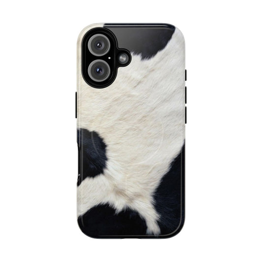 A black and white cow print phone case with a magnetic closure