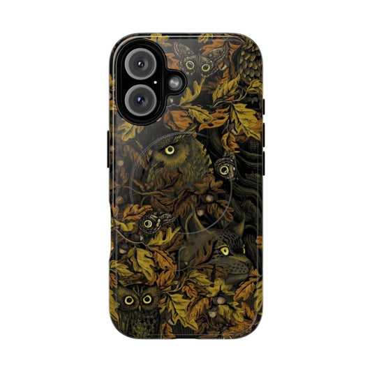 A close-up of a nature-inspired phone case with a camouflage design featuring autumn leaves, an owl's eye, and other natural elements.