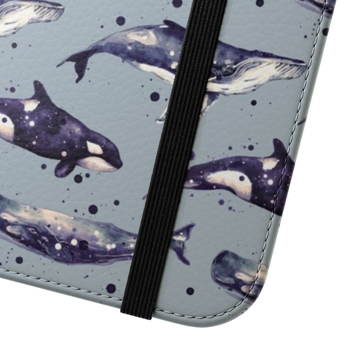 Watercolor painting of three whales - orca, sperm, and humpback - in shades of blue on a grey flip cover phone case - Close Up