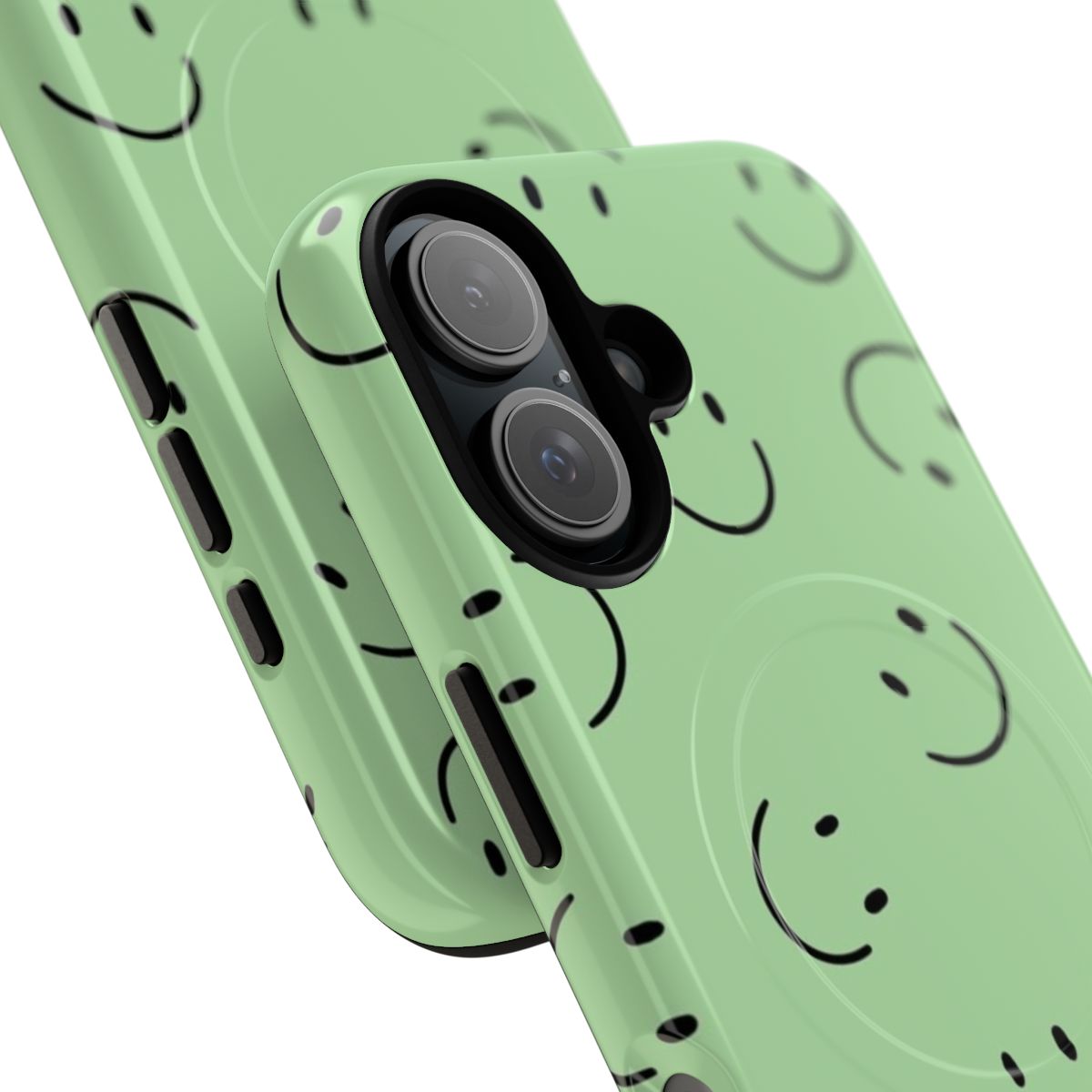 Closeup of a green smiley face design on a magnetic tough phone case. - Detail