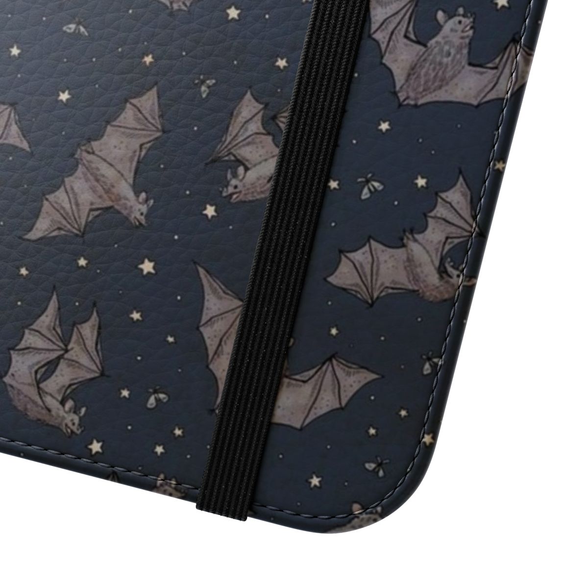 A flip phone case featuring a whimsical design of bats against a starry night sky - Close Up