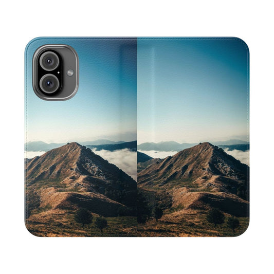 A flip cover phone case featuring a scenic mountain landscape design.