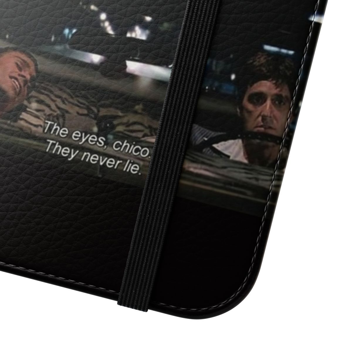 Scarface-inspired flip cover phone case featuring the iconic "The Eyes, Chico. They never lie." quote - Close Up