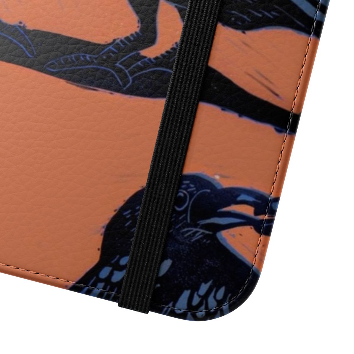 Close-up image of an orange and black crow pattern printed on a flip phone case. - Close Up