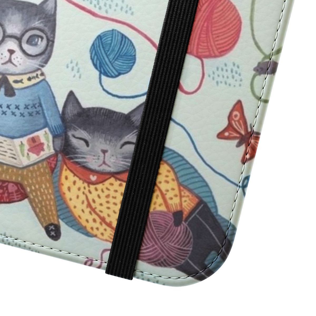 Vibrant flip cover phone case featuring a playful pattern of kittens, cats, and colorful designs. - Close Up